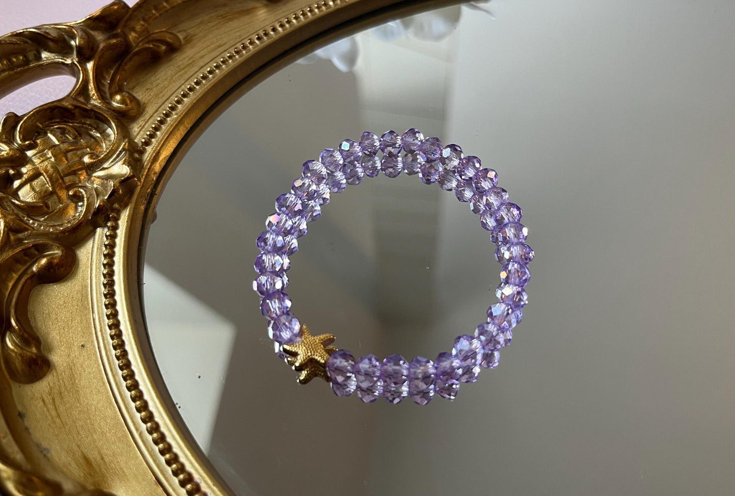Glitzerarmband, Freundschaftsarmband, funkelndes Armband aus glitzernden Facettperlen in Flieder mit goldenem Seestern - Laury goes Cancùn