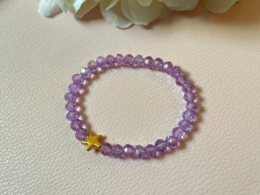 Glitzerarmband, Freundschaftsarmband, funkelndes Armband aus glitzernden Facettperlen in Flieder mit goldenem Seestern - Laury goes Cancùn